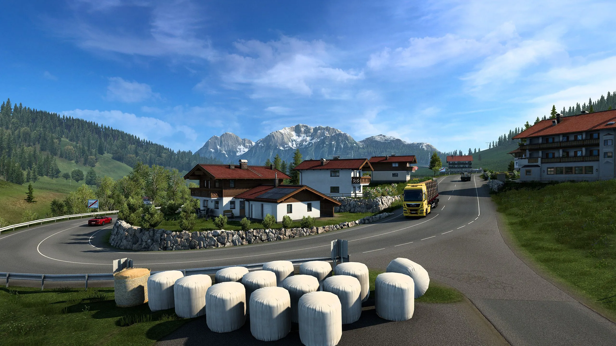 Cảnh quan đường cao tốc và chiếc xe tải nặng trên bản đồ châu Âu của Euro Truck Simulator 2, thể hiện trải nghiệm lái xe mô phỏng chân thực