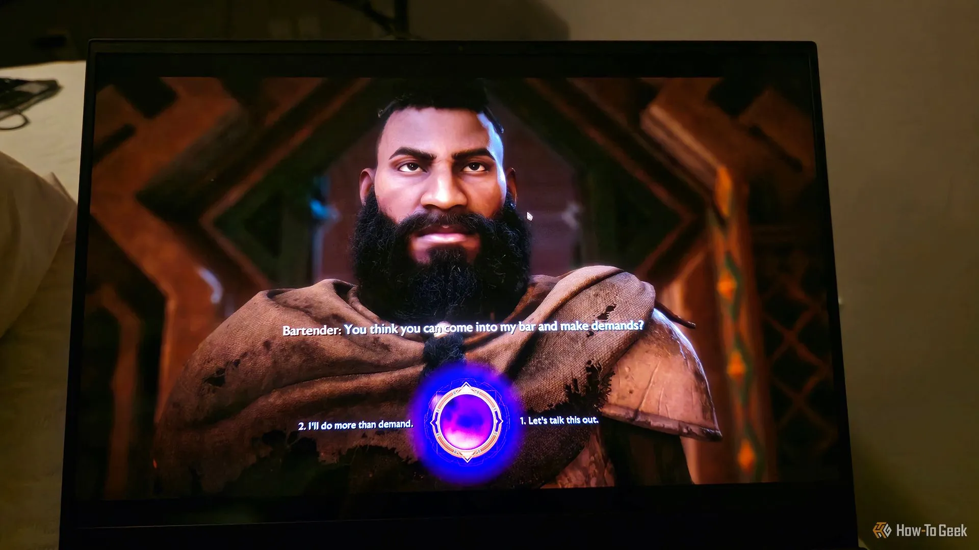 Màn hình laptop Razer Blade 16 (2025) đang chơi game Dragon Age: The Veilguard, minh họa đồ họa hiện đại
