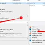 Menu chuột phải hiển thị tùy chọn "Mở với" và chọn "Notepad" để mở file XML trên Windows.