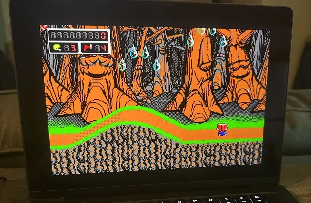 Tựa game platformer Commander Keen chạy trên máy tính MacBook Pro, minh họa khả năng tương thích hiện đại.
